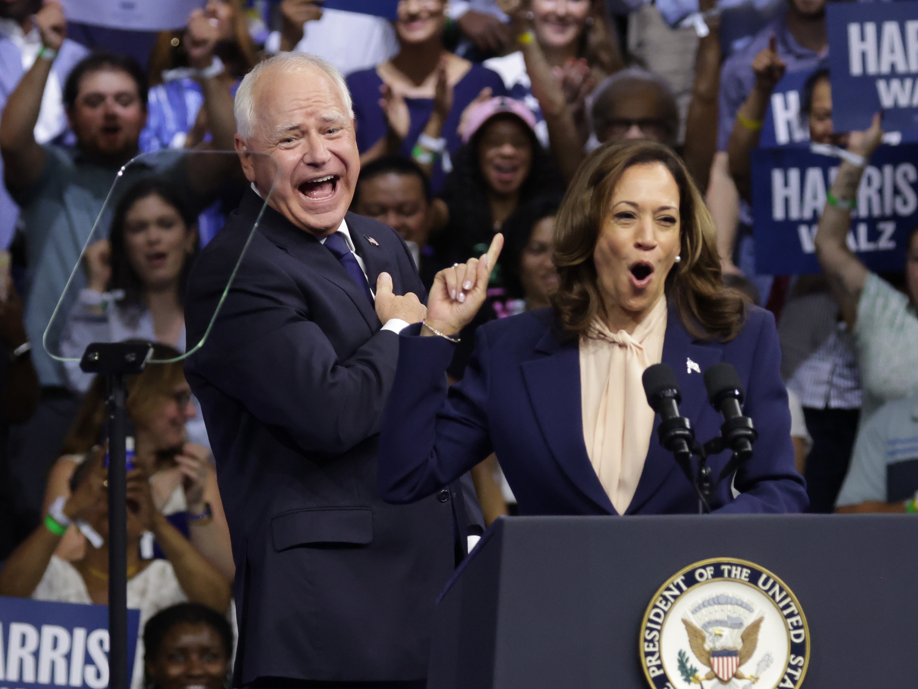 caption: Vice President Harris introduces Minnesota Gov. Tim Walz as her running mate during a campaign rally at Temple University in Philadelphia on Tuesday. 