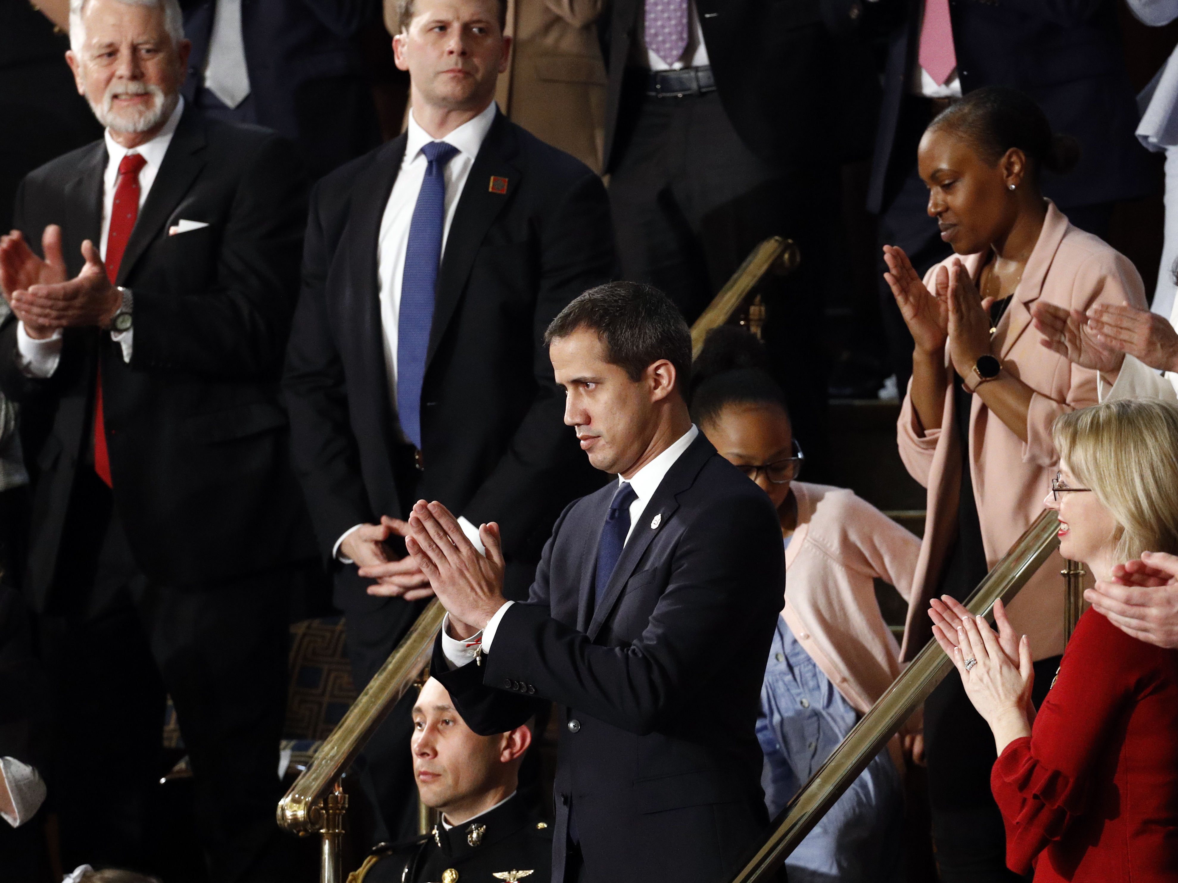 caption: Venezuelan opposition leader Juan Guaidó applauds as President Trump delivers his State of the Union address to a joint session of Congress.