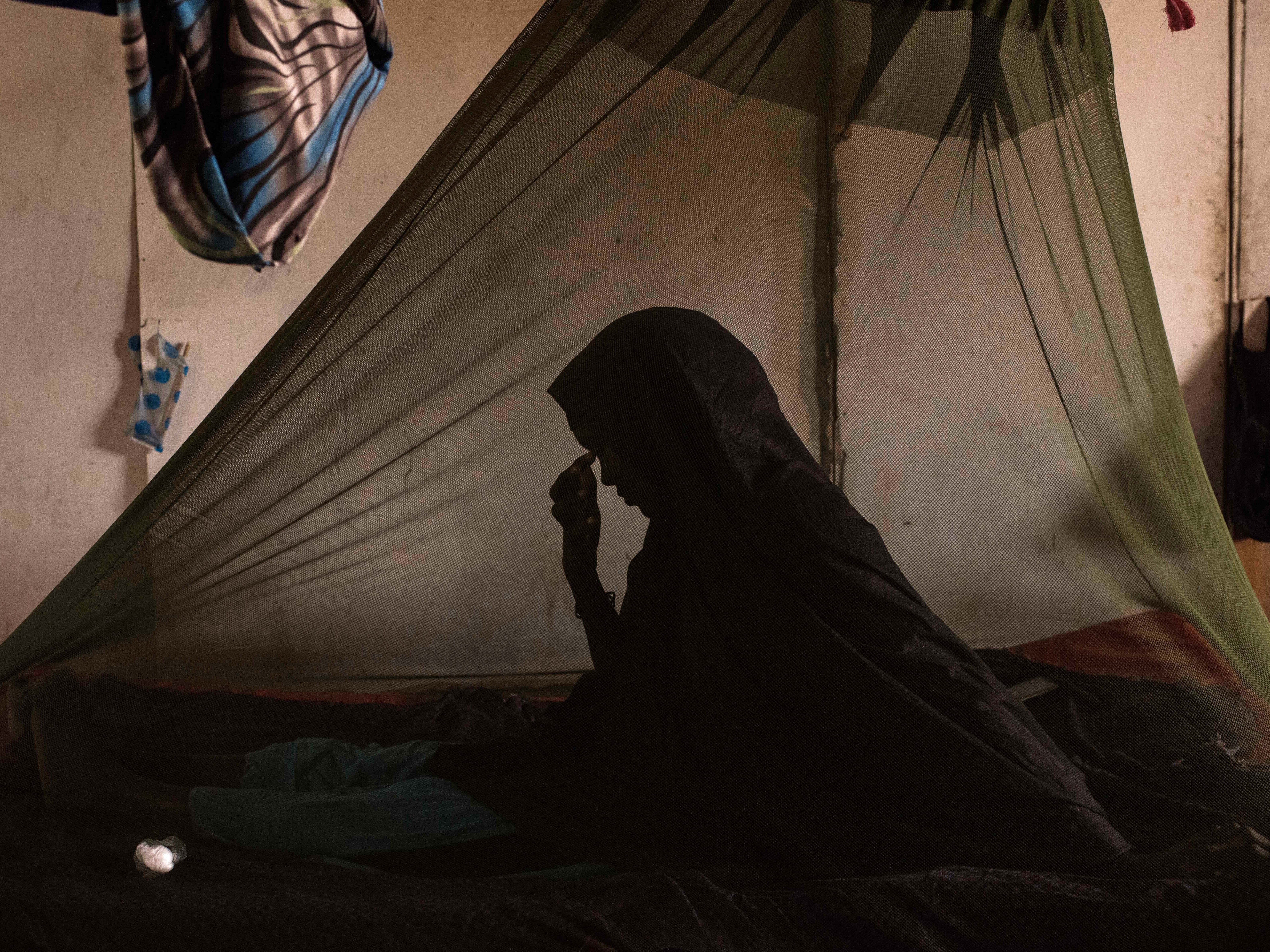 caption: A woman diagnosed with tuberculosis receives care at Barawe General Hospital in Somalia.
