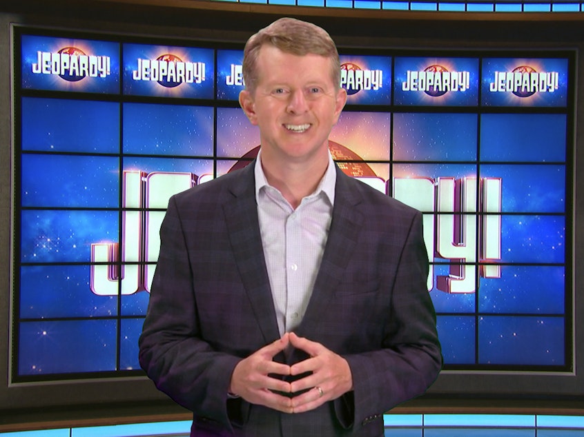 caption: This image released by JEOPARDY! shows Ken Jennings, a 74-time champion the the set of the popular quiz show. Jennings will be the first interim guest for the late Alex Trebek, and the show will try other guest hosts before naming a permanent replacement.