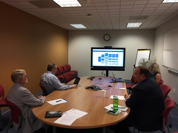caption: <p>Oregon education officials look at a "beta" version of the Statewide Longitudinal Data System in August 2018.&nbsp;</p>