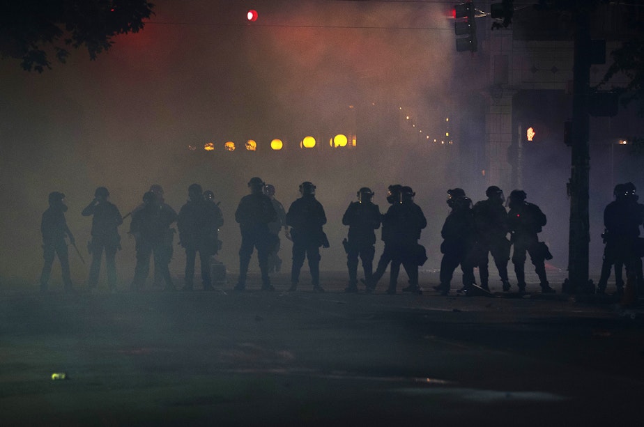 caption: After more than 6 hours of a peaceful protest, law enforcement released tear gas, flash-bang grenades, pepper spray, and rubber bullets on hundreds of people near Cal Anderson Park on Tuesday, June 2, on the fifth day of protests in Seattle following the murder of George Floyd.