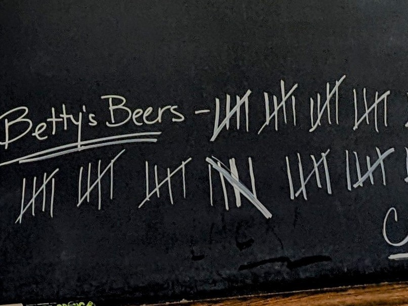 caption: A tally on the chalkboard at Commerce Street Brewery in Mineral Point, Wis., shows that people have bought more than 110 beers for the late comedian Betty White.