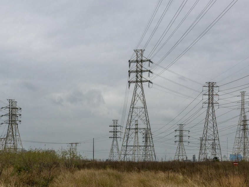 caption: Transmission towers in Houston as the storm carrying frigid temperatures approached. The storm tested the reliability of the grid in Texas and across the country, but did not trigger a widespread power crisis.