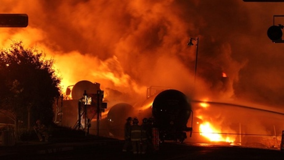 caption: The Transportation Safety Board released a report on Tuesday on the Lac-Megantic oil train derailment, which killed 47 and destroyed dozens of building.