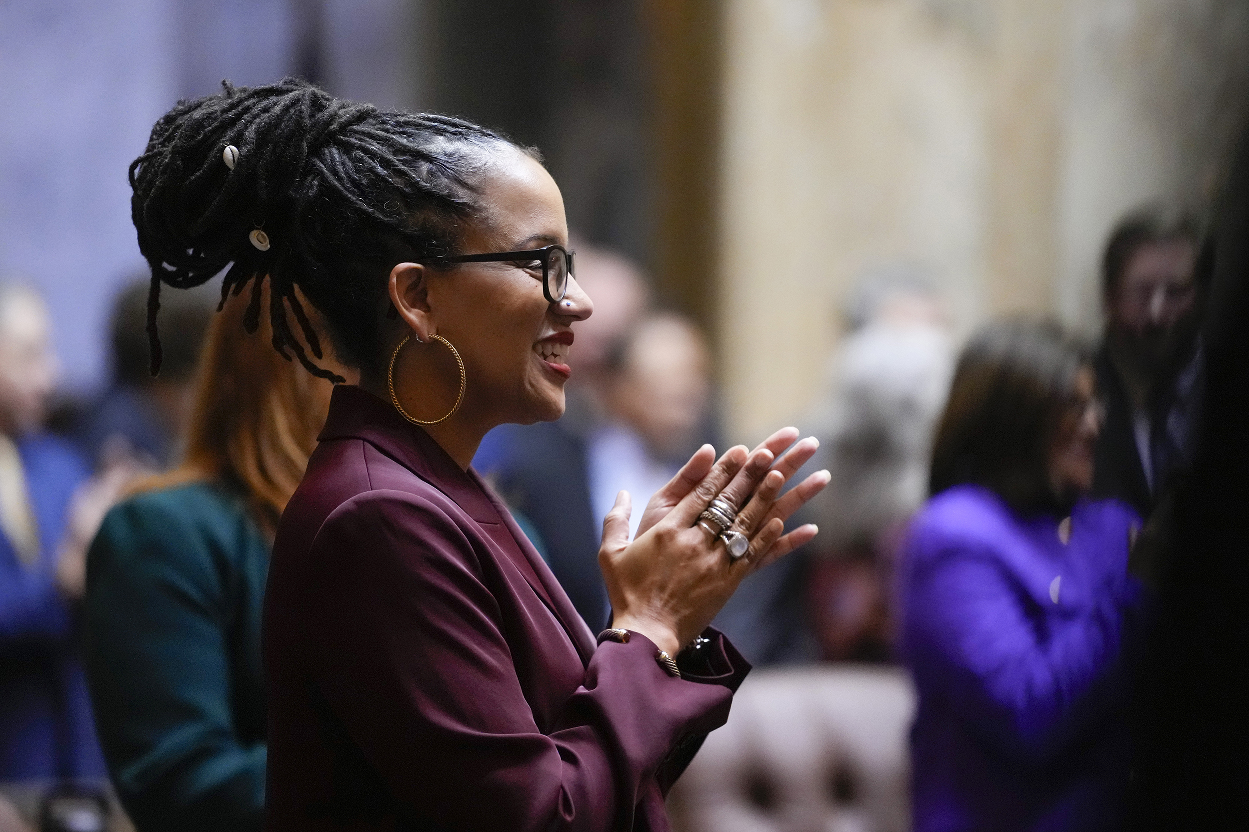 caption: Rep. April Berg, D-Mill Creek, claps on the first day of the legislative session at the Washington state Capitol, Monday, Jan. 8, 2024, in Olympia, Wash.