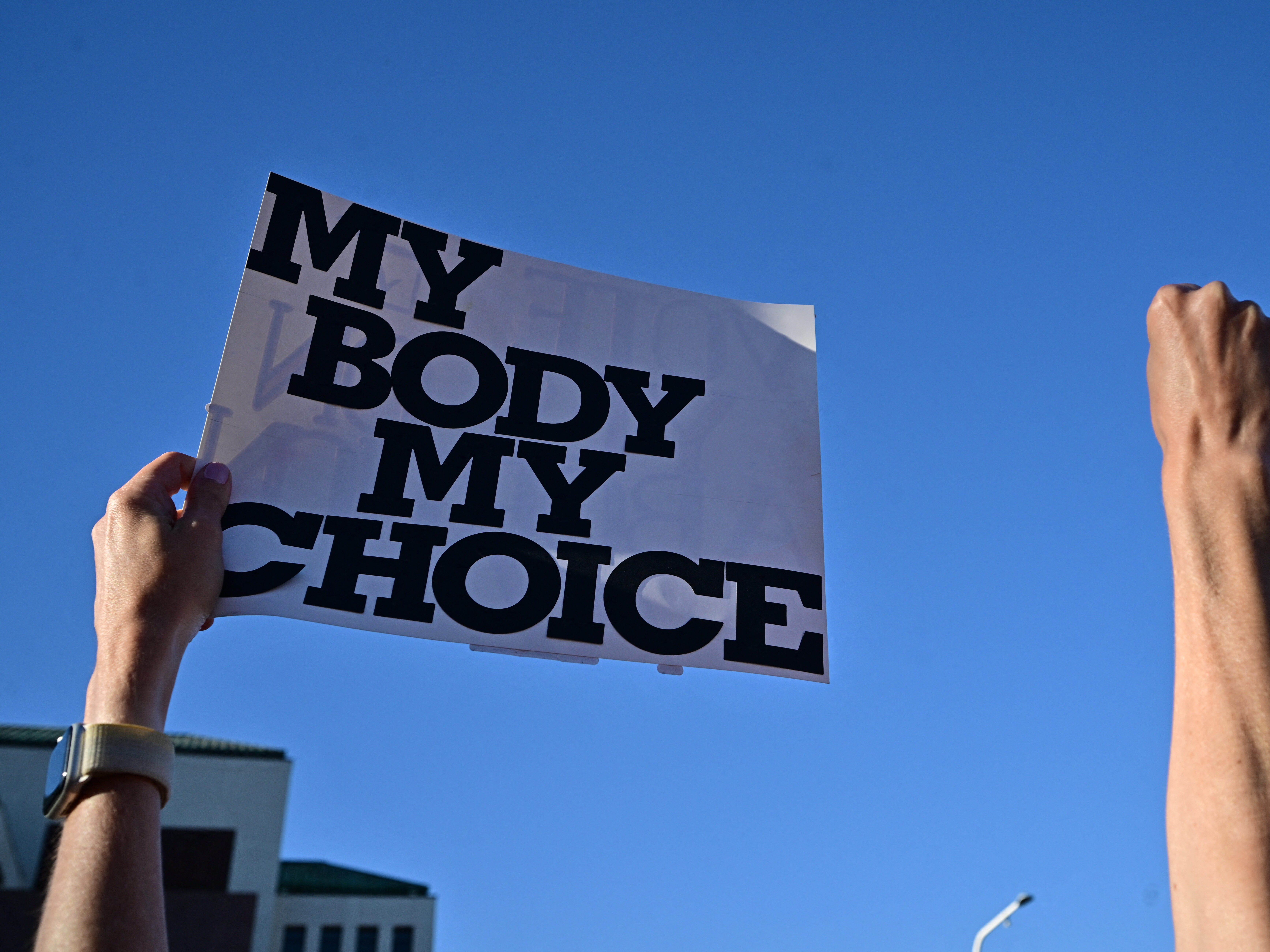 caption: Demonstrators rally in Scottsdale, Arizona.