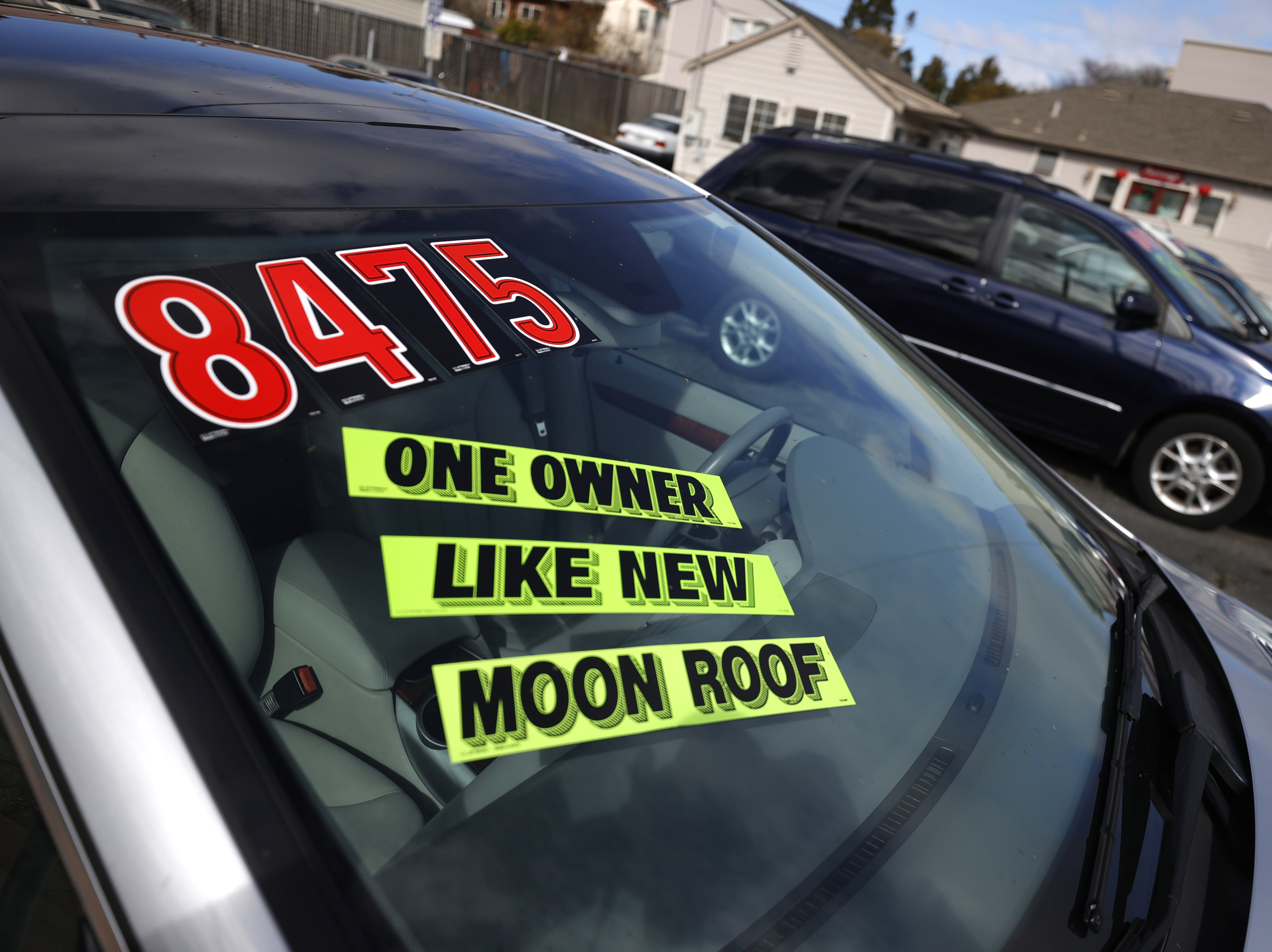 caption: Used cars sit on the sales lot at Frank Bent's Wholesale Motors in El Cerrito, Calif., on March 15. Supply chain snarls and pent-up demand are driving up the prices of a lot of things, including new and used cars.