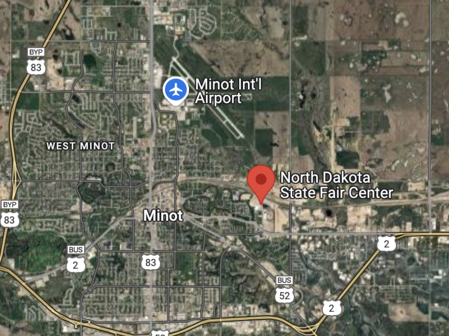caption: A Google Maps image shows Minot International Airport's close proximity to the North Dakota Fair grounds. An airliner that was approaching the airport from the southeast deviated course into an abrupt go-around on Friday — at around the same time a bomber performed a flyover at the fair.