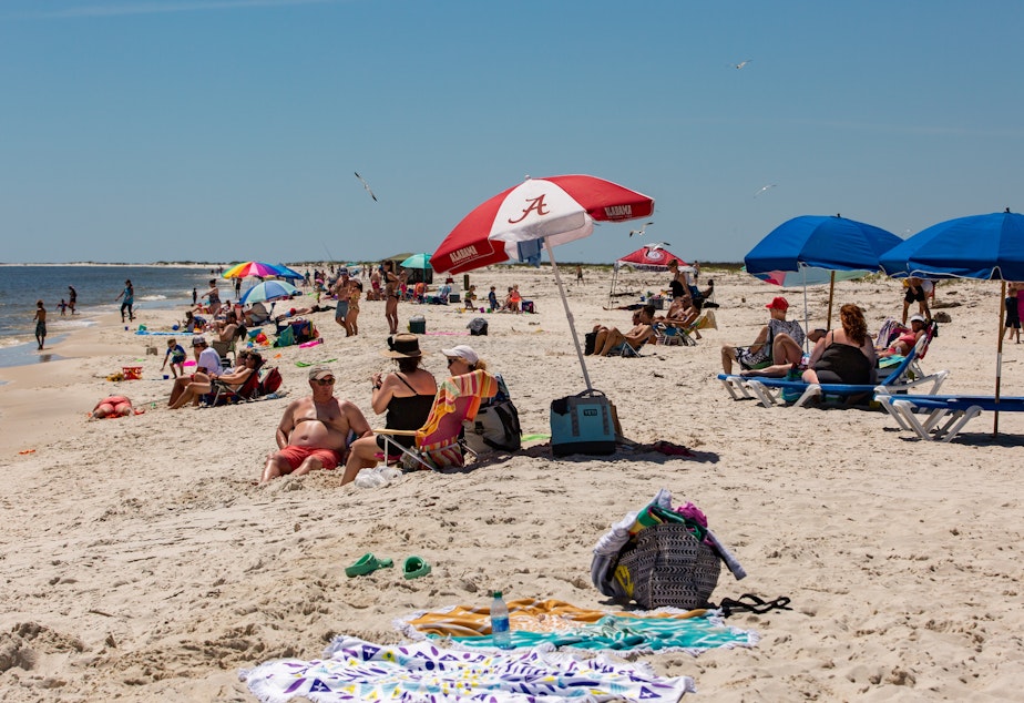 caption: Alabama opened public beaches on May 1. Gov. Kay Ivey is letting casinos, museums, zoos and amusement parks open Friday afternoon.