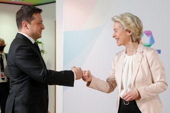 caption: European Commission President Ursula von der Leyen (right) greets Ukraine's President Volodymyr Zelenskyy (left) at the Eastern Partnership summit in Brussels last year. Zelenskyy is appealing for Ukraine to join the EU.