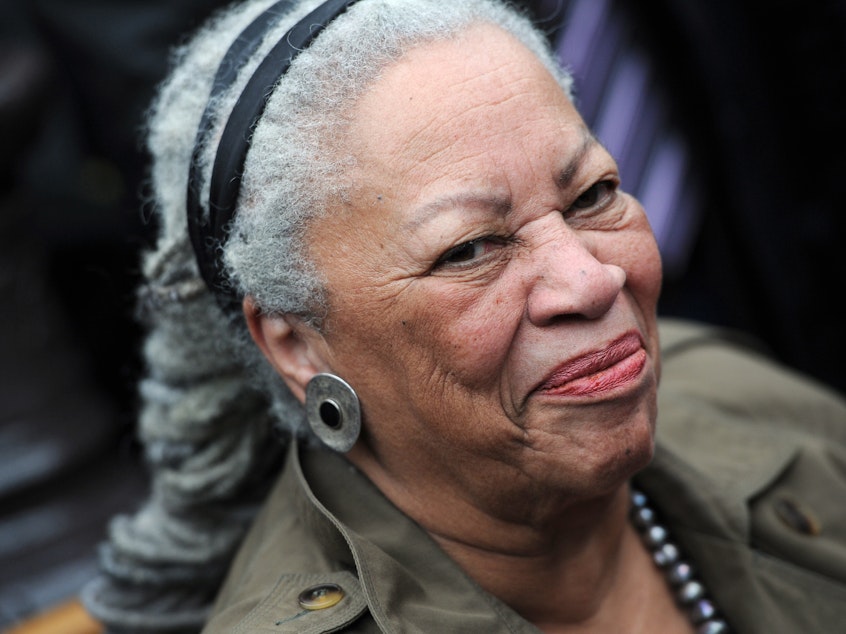 caption: Novelist Toni Morrison, seen at the unveiling ceremony of a memorial bench marking the abolition of slavery in Paris in 2010.