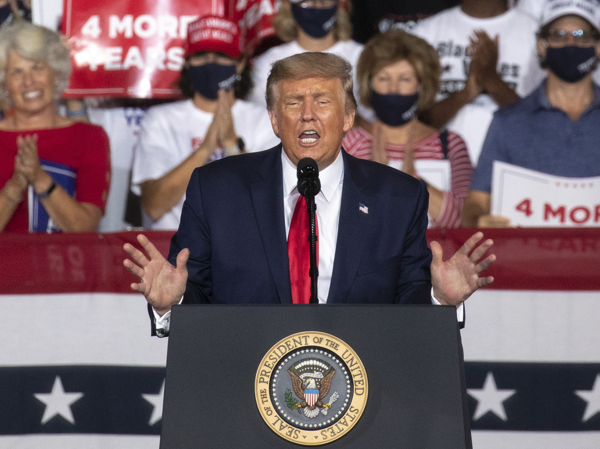 caption: U.S. President Donald Trump speaks during a campaign rally in Winston-Salem, N.C. on Sept. 8.