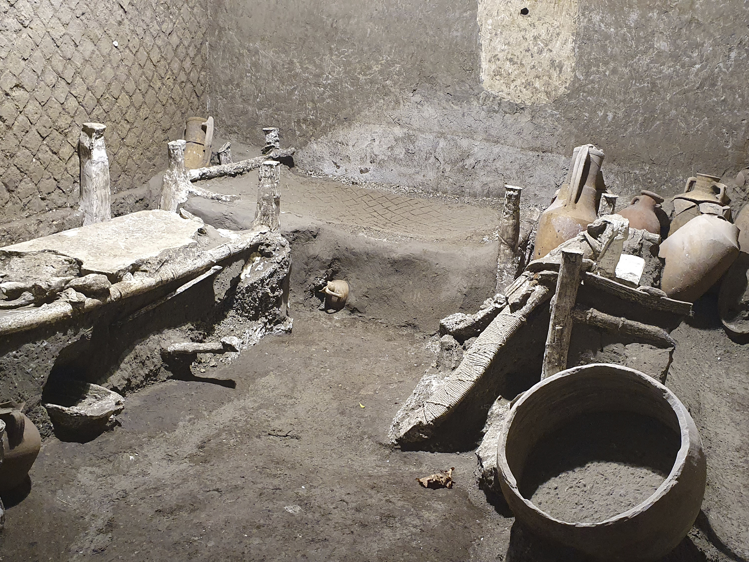 caption: A view of the latest finding in Pompeii, Italy. Archeologists, excavating a villa amid the ruins of the 79 A.D. volcanic eruption, have discovered a room that served as both a dormitory and storage area.