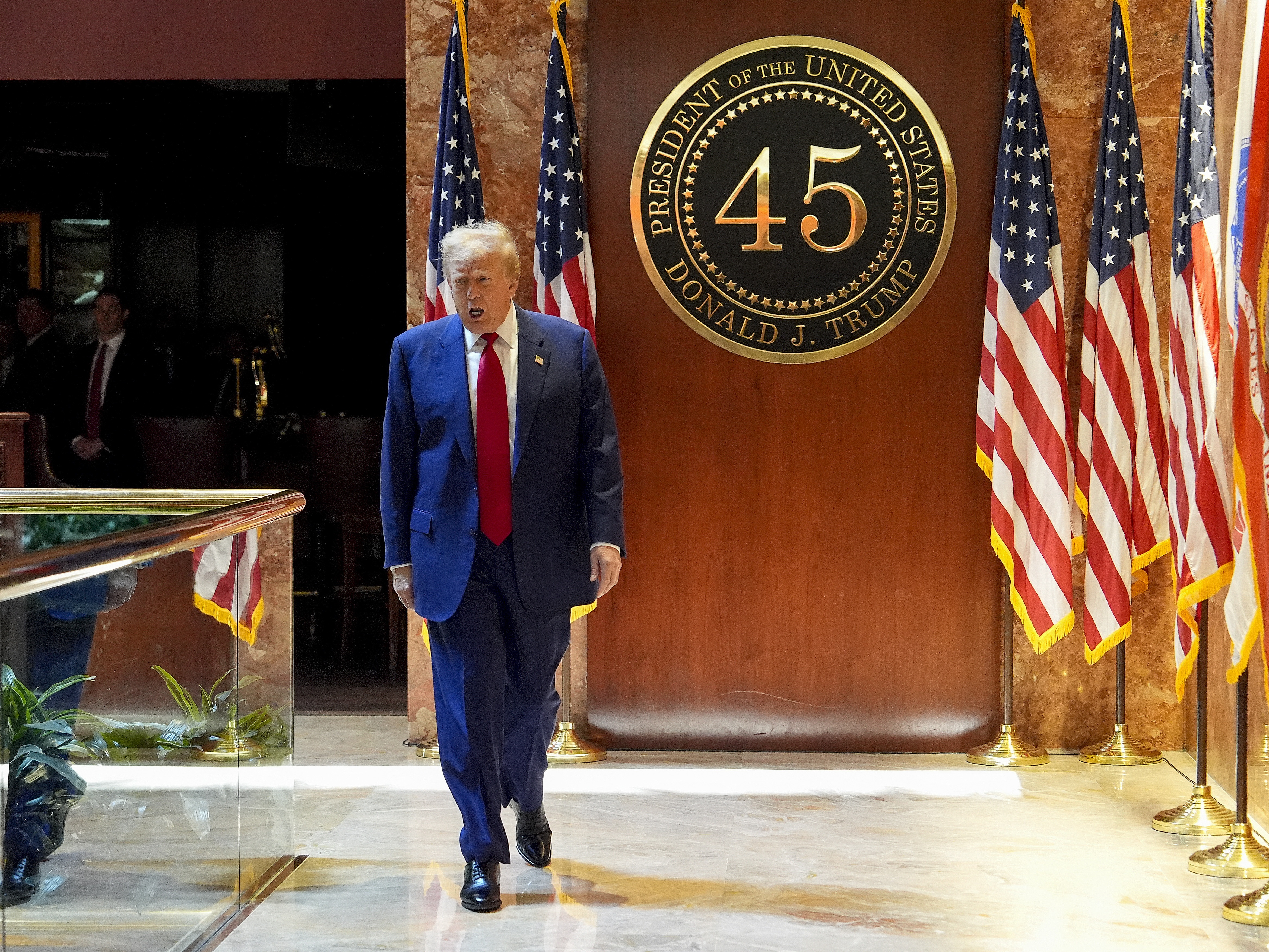 caption: Former President Donald Trump arrives to speak at a news conference at Trump Tower, Friday, May 31, in New York.