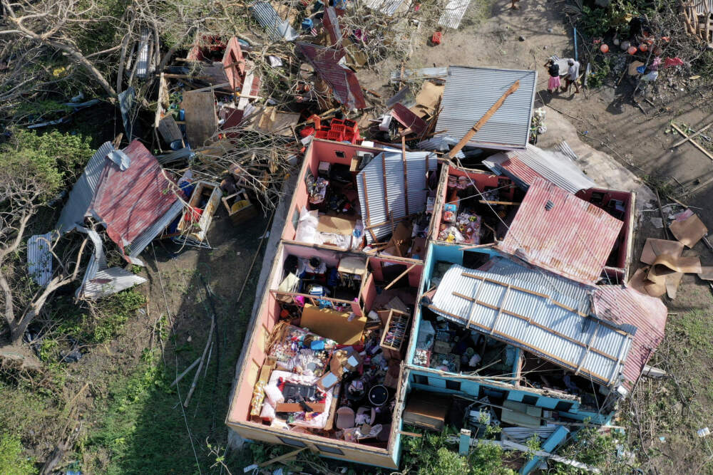 caption: An aerial view of a home where the roof was blown off is seen after Hurricane Beryl passed through the area. (Joe Raedle/Getty Images)