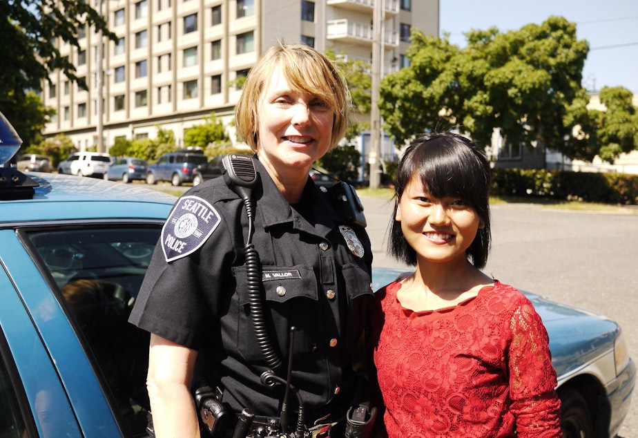 caption: Officer Michelle Vallor and community leader Vung It.