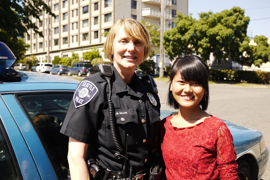 caption: Officer Michelle Vallor and community leader Vung It.