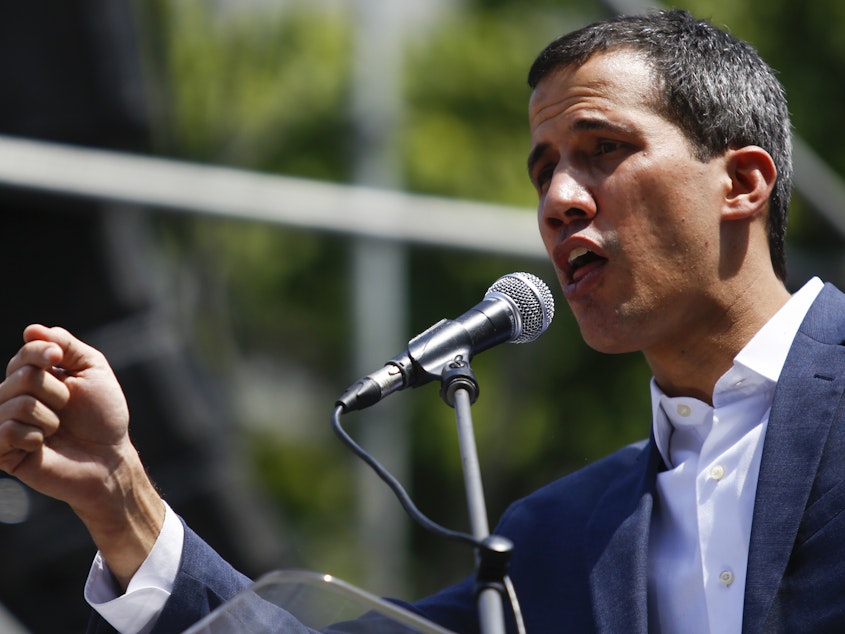 caption: Opposition leader and self-proclaimed interim president of Venezuela Juan Guaidó talks to supporters during a rally against the government of Nicolás Maduro on Feb. 2.