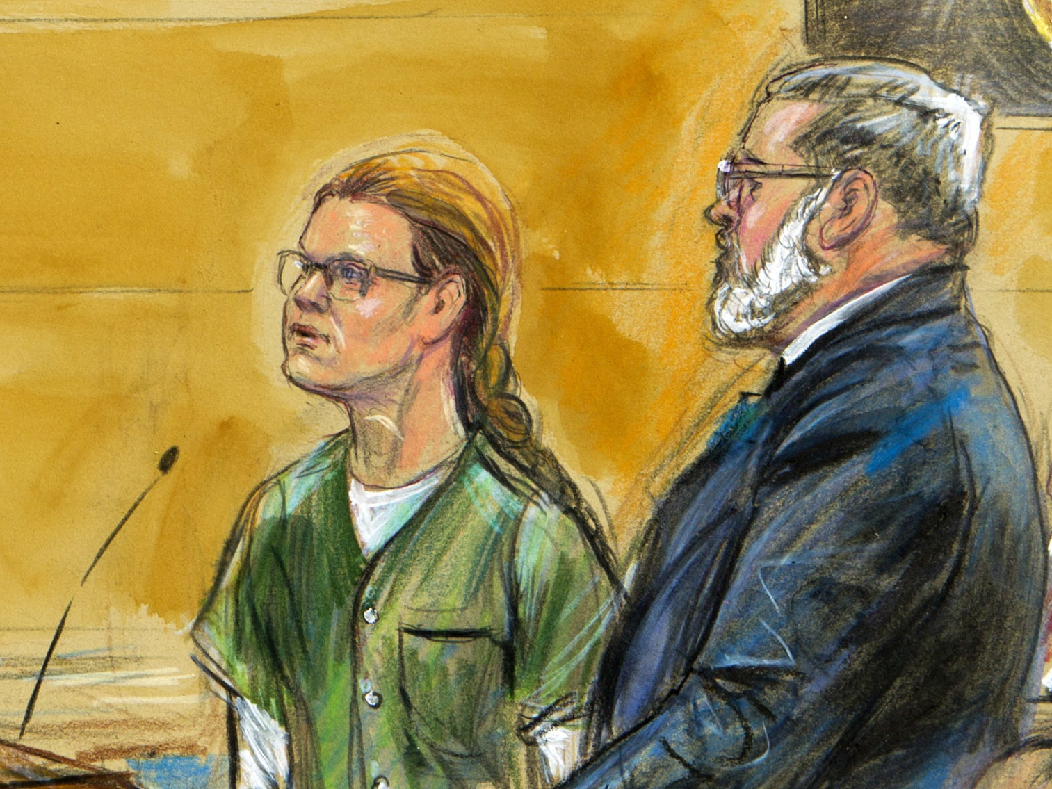 caption: Maria Butina, seen in this courtroom sketch, stands beside her attorney Robert Driscoll during a court hearing late last year in Washington, D.C. The Russian woman has been released from prison after serving out her sentence for conspiracy.