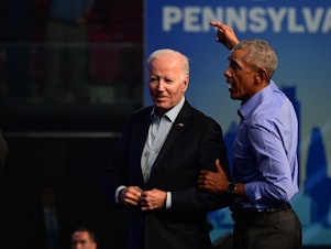 caption: Former-President Barack Obama and President Joe Biden at a rally for Pennsylvania Democratic midterm candidates in November. The Justice Department is reviewing classified documents found by Biden's personal attorneys, materials that were turned over to the National Archives the day after they were discovered.