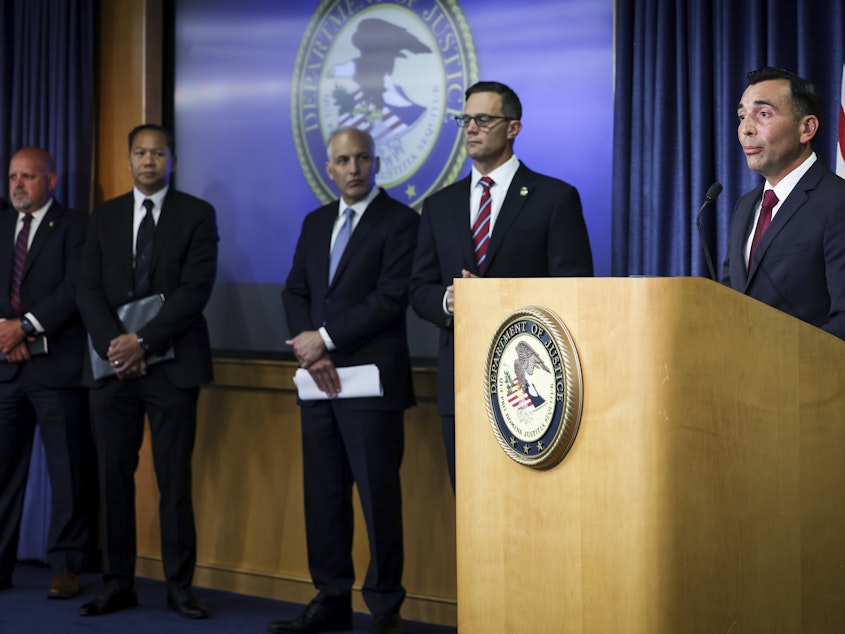 caption: U.S. Attorney Martin Estrada for the Central District of California, right, speaks during a press conference at the U.S. Attorney's Office for the Southern District of California on Thursday, Aug. 3, 2023, in San Diego.