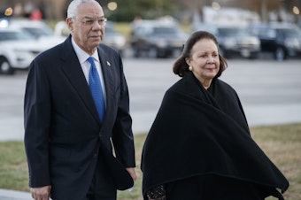 caption: Former Secretary of State Colin Powell, seen here in December 2018 with his wife, Alma, said he would vote for Joe Biden.