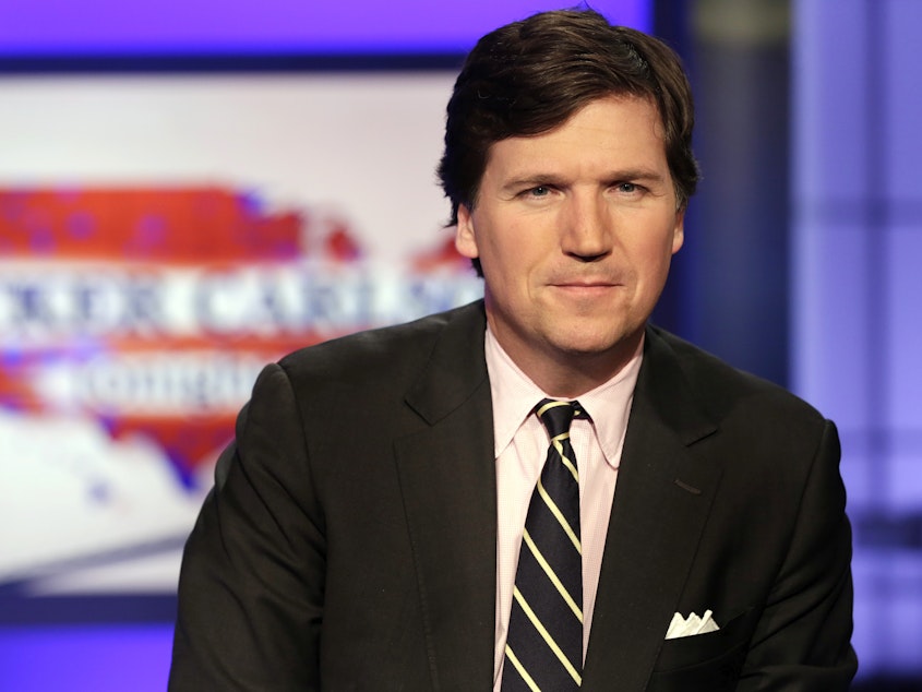 caption: Tucker Carlson, host of "Tucker Carlson Tonight," on the set of his Fox News program.