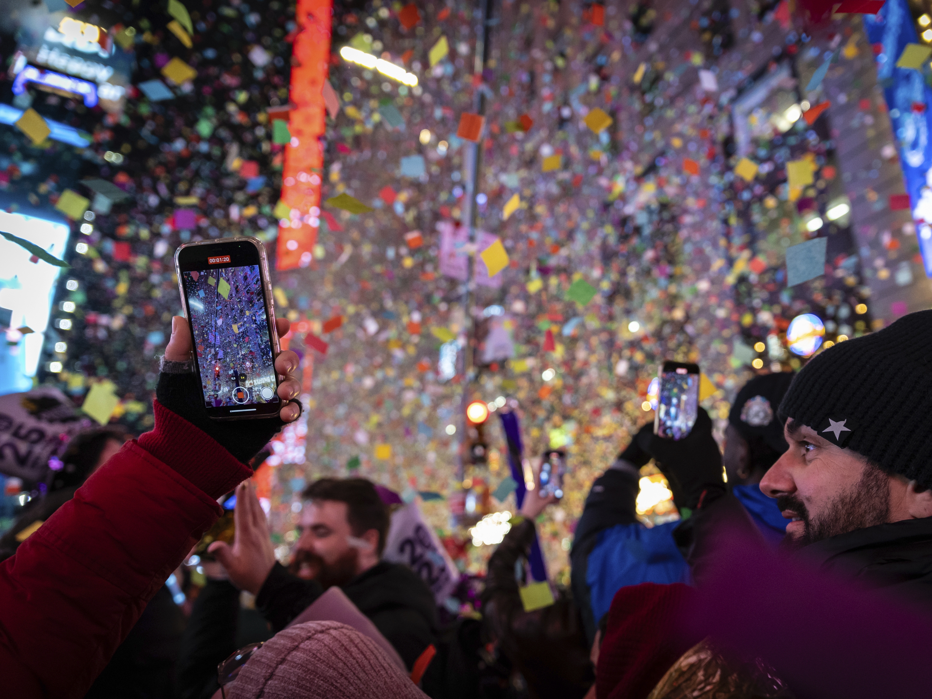 caption: Revelers celebrate after the ball drops in New York's Times Square, Wednesday, Jan. 1, 2025, in New York.