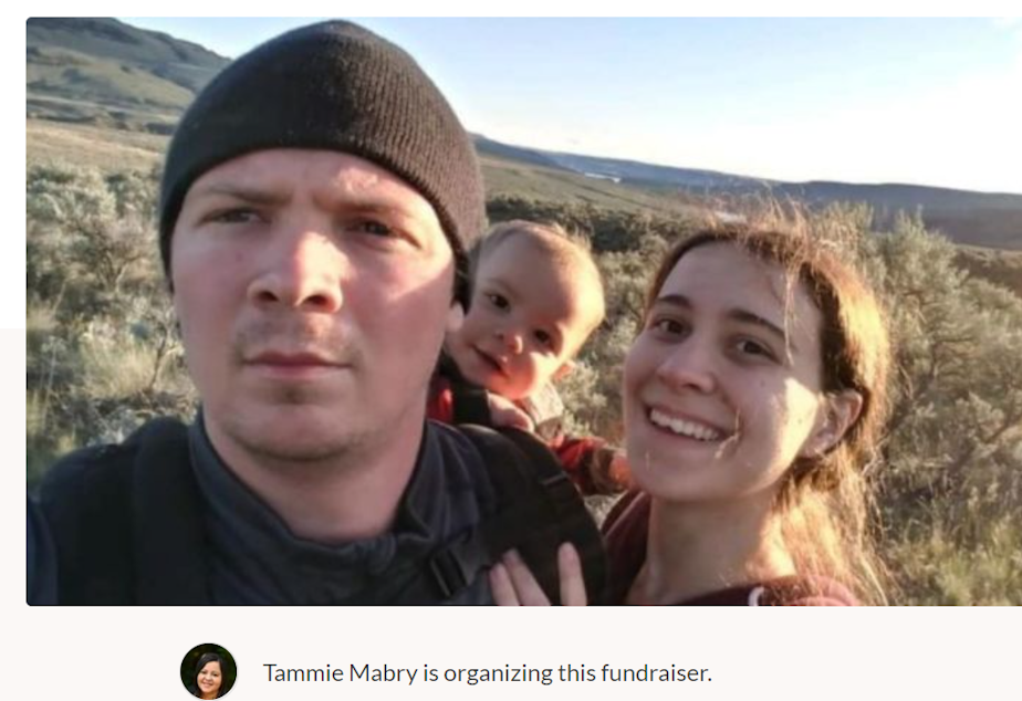caption: Jake, Jamie, and Uriel Hyland. The Hylands were caught in a fast-moving fire over the weekend. Uriel, age 1, died, and parents Jake and Jamie were evacuated to Harborview Medical Center.