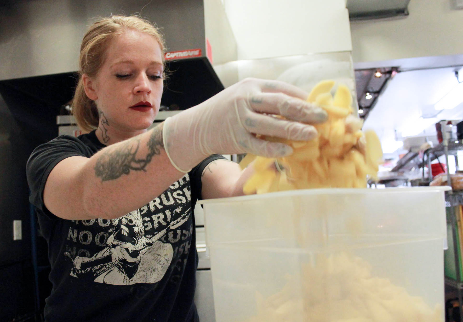 caption: Emily Phillips is Marination's Commissary Manager. She and her crew of 10 cook the rice, marinate the meats and do all the food prep for the restaurants.