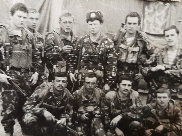 caption: Over half a million Soviet troops served in Afghanistan between 1979 and 1989. Among the first deployed was Rustam Khodzhayev, seen posing here (front row, first from the left) with his special operations unit in 1981.