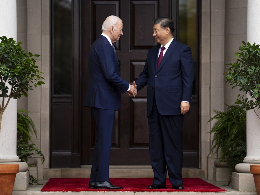 caption: President Joe Biden greets China's leader Xi Jinping at the Filoli Estate in Woodside, Calif., Nov, 15, 2023, on the sidelines of the Asia-Pacific Economic Cooperative conference.