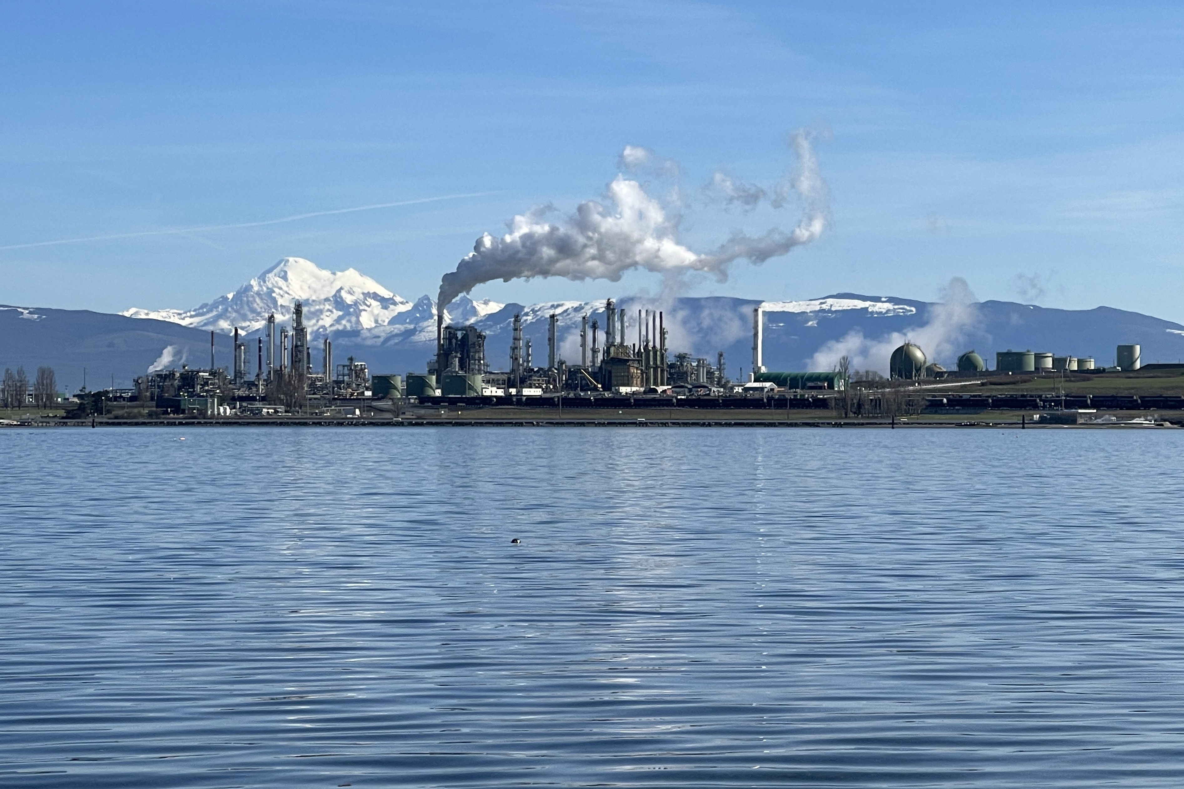caption: Major polluters, like the Marathon refinery shown on Mar. 16, 2024, in Anacortes, Washington, have to calculate and disclose their climate-altering emissions.
