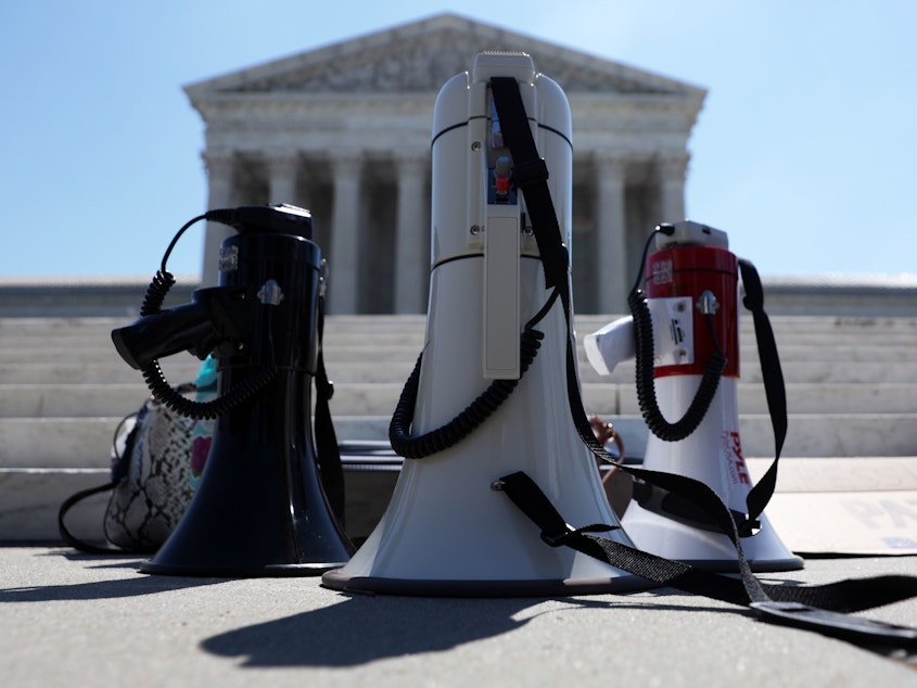 caption: Bullhorns are seen during a demonstration in front of the Supreme Court on June 29. The court had a momentous term with cases ranging from President Trump's financial records to immigration and abortion.