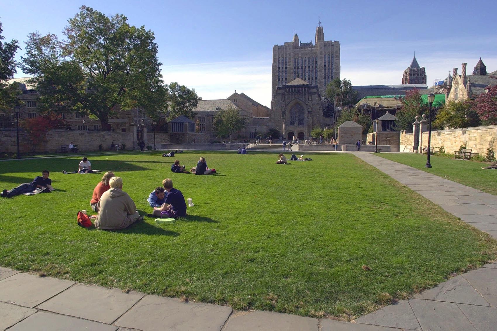 caption: Yale University students and others spend a fall afternoon on Yale University's Cross Campus in New Haven, Conn., in an Oct. 11, 2000 file photo. (AP Photo/Bob Child/file)