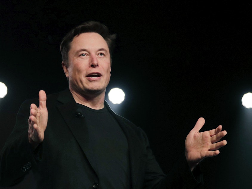 caption: Tesla CEO Elon Musk speaks in March 2019 before unveiling the Model Y at Tesla's design studio in Hawthorne, Calif.. Musk's legal team is demanding to hear from a whistleblowing former Twitter executive who could help bolster Musk's case for backing out of a $44 billion deal to buy the social media company.