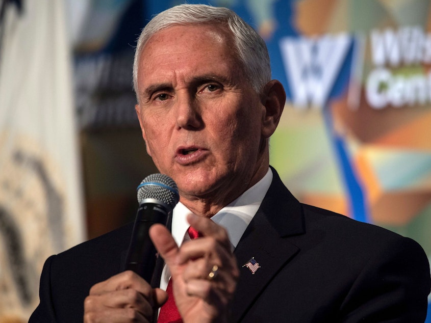 caption: Vice President Mike Pence speaks about U.S.-China relations in Washington. Nicholas Kamm/AFP/via Getty Images