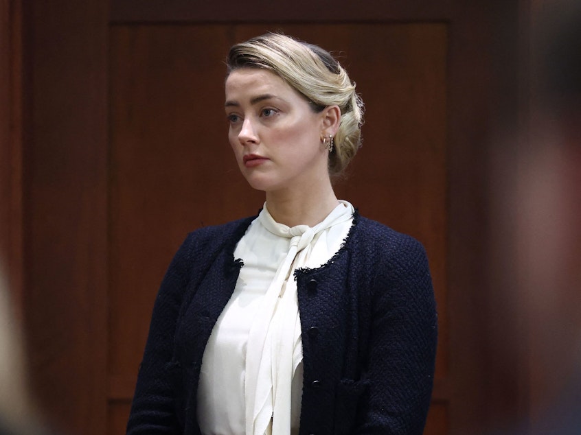 caption: US actress Amber Heard returns from a break to the Fairfax County Circuit Courthouse in Fairfax, Virginia on Thursday.