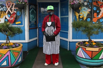 caption: Brother Anthony Mohammad at his Fish House Cafe on MLK Jr Way in Tacoma's Hilltop Neighborhood