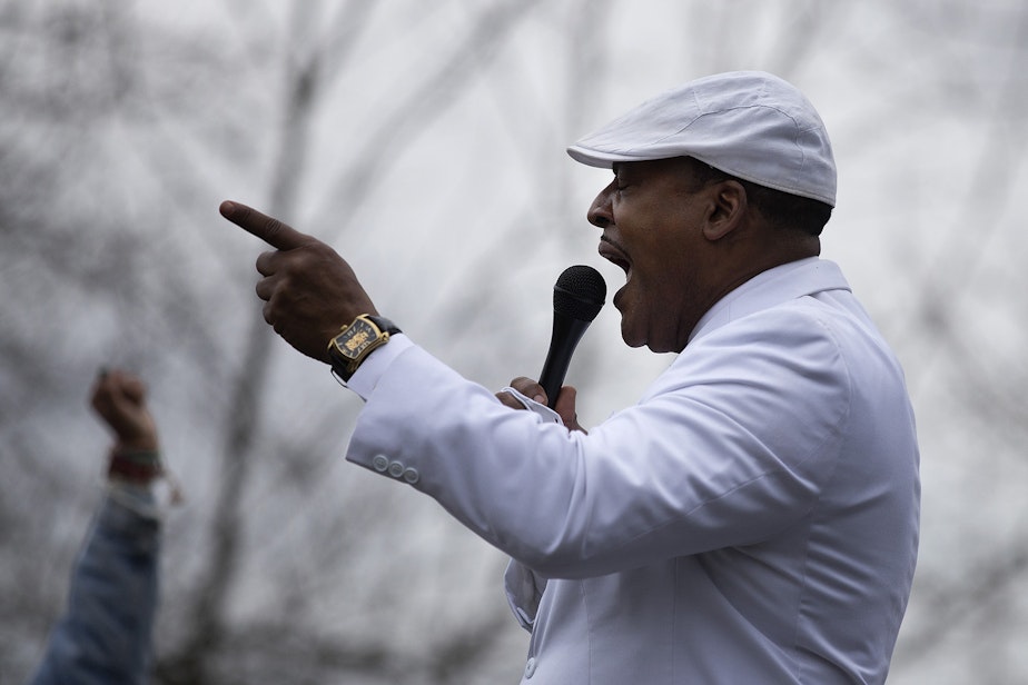 caption: Reverend Dr. Leslie Braxton speaks to a crowd after a silent march in honor of Manuel Ellis, who was killed by Tacoma police roughly one year ago, on Sunday, February 28, 2021, at People's Park in Tacoma. "He was literally lynched on the pavement," said Reverend Braxton. "Don’t get it twisted. He was literally lynched on the pavement.” 