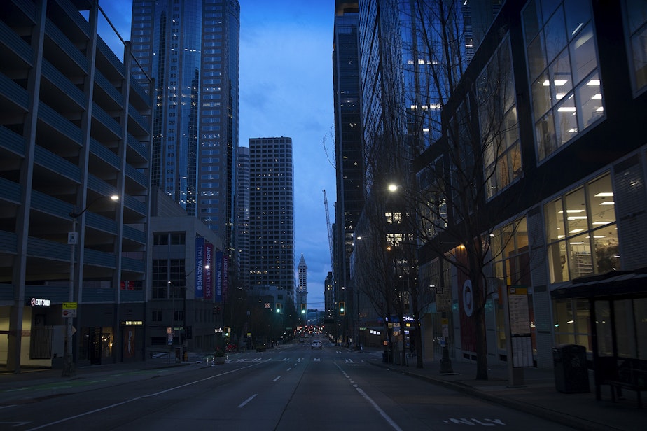 caption: A quieter than usual downtown Seattle is shown on Sunday, March 22, 2020, at the intersection of 2nd Avenue and Union Street in Seattle.