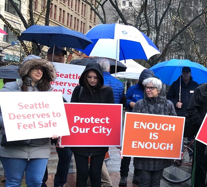 caption: A rally organized by the Downtown Seattle Association Friday called for a new safety strategy in the wake of the Jan. 22 shootings. 