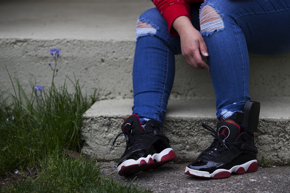 caption: Kandis Mello's ankle monitor is shown on Friday, May 1, 2020, at her home in Burien.