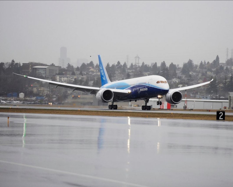 caption: The Boeing 787 lands at Seattle's Boeing Field after its maiden flight from Paine Field in Everett.
