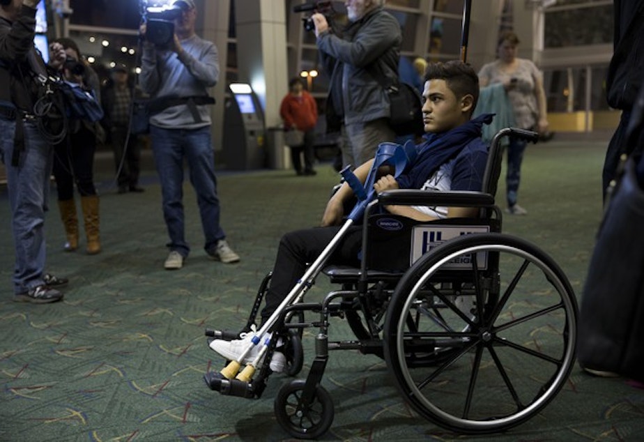 <p>A travel weary Mustafa Abed arrives in Portland for medical attention. His leg was severed near the hip in a U.S. missile strike in Fallujah when he was two.</p>