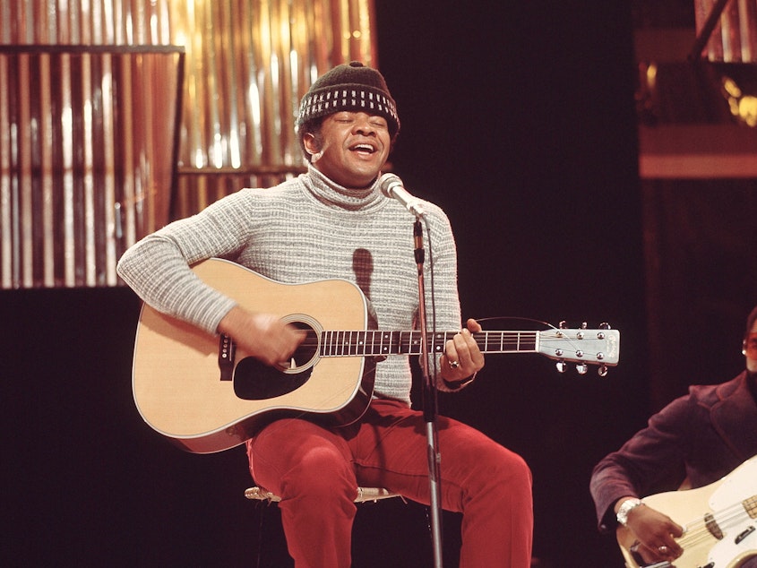 caption: Bill Withers, performing on television in London in 1972.