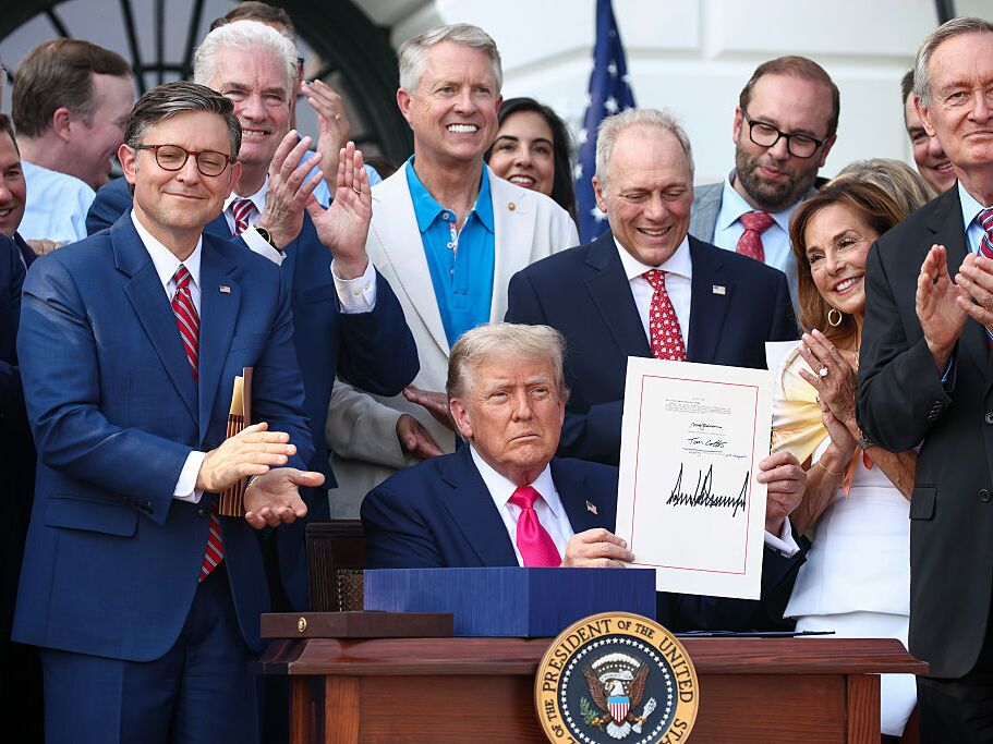 caption: U.S. President Donald Trump, joined by Republican lawmakers, signs the One, Big Beautiful Bill Act into law on July 04, 2025 in Washington, DC. The law includes cuts to funding for Medicaid, food assistance and other social safety net programs.
