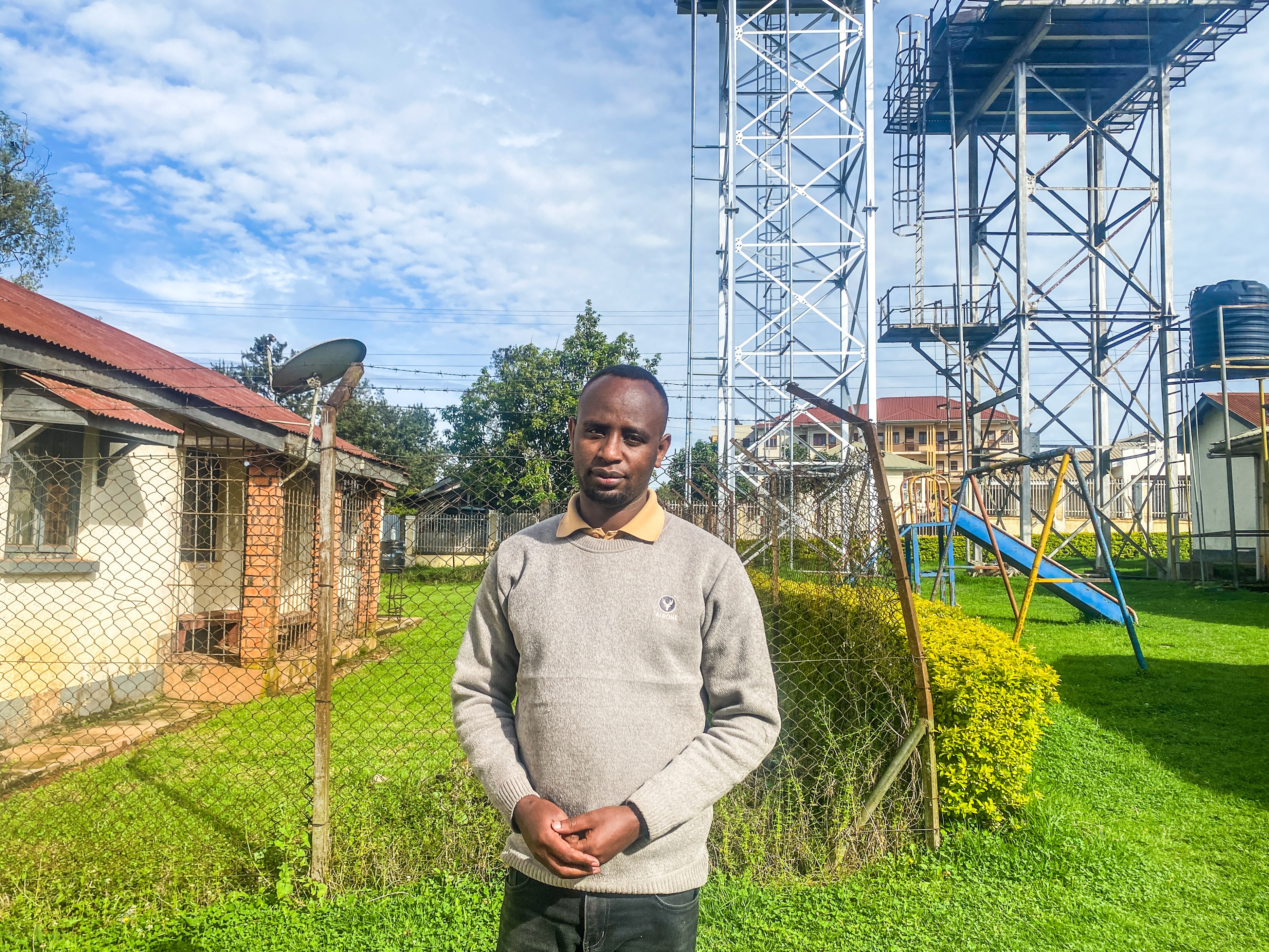 caption: Harerimana Ismail is a community health care worker in Kabale District, Uganda, who supports children and teens living with HIV. He lost his salary as part of the U.S. aid cuts but continues doing his job.