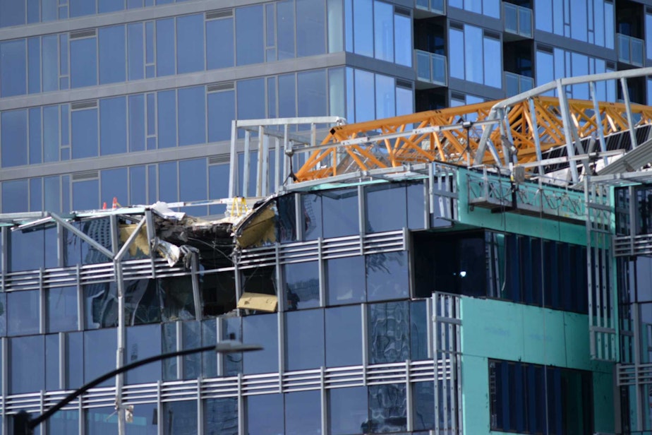 caption: A crane collapsed on a building, killing four people on Saturday, April 27, 2019.
